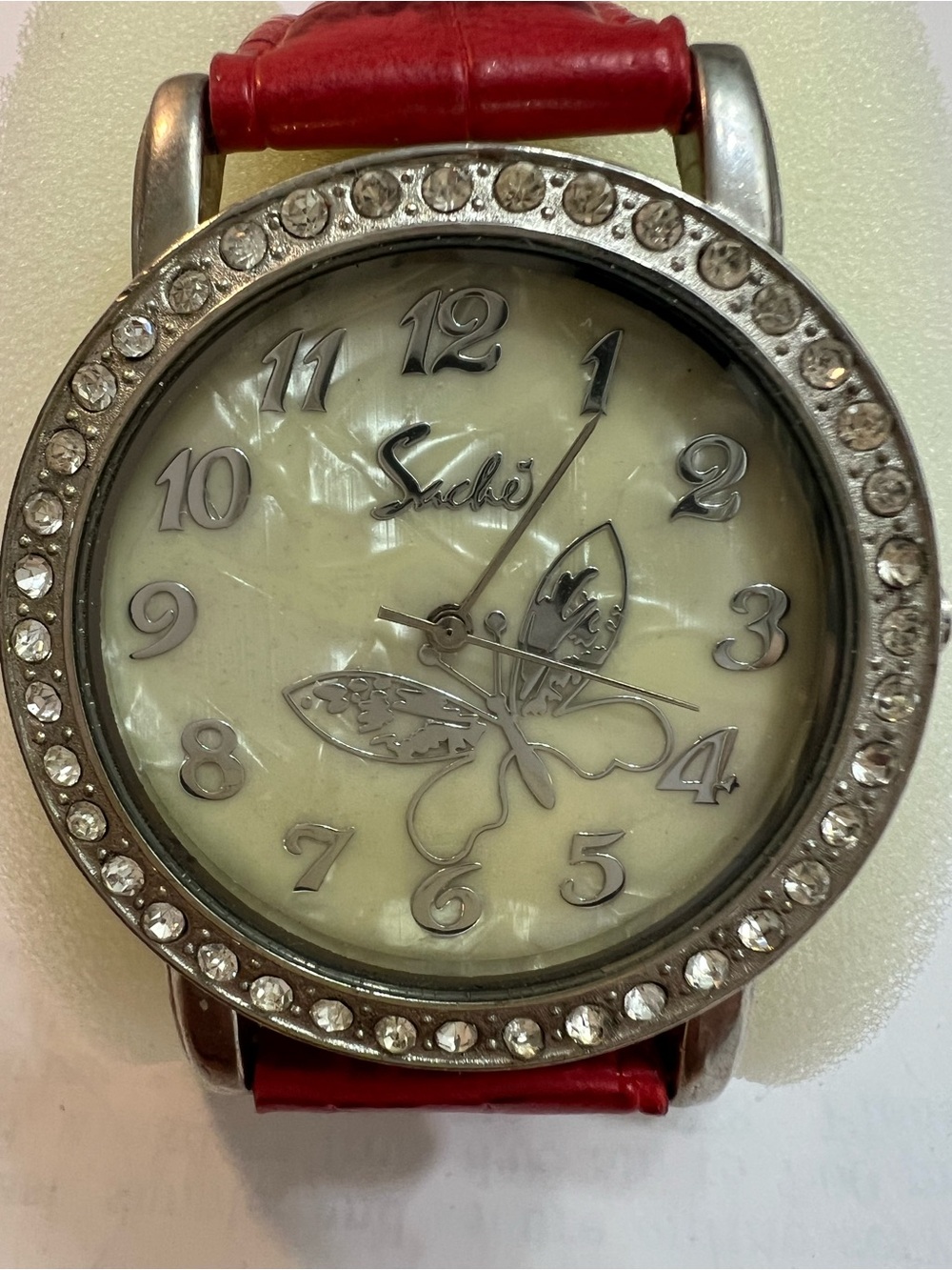 NAK Silver Crystal-Trim Watch with Red Strap and Butterfly Dial